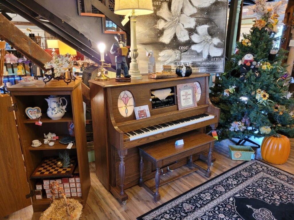 antique piano and tree