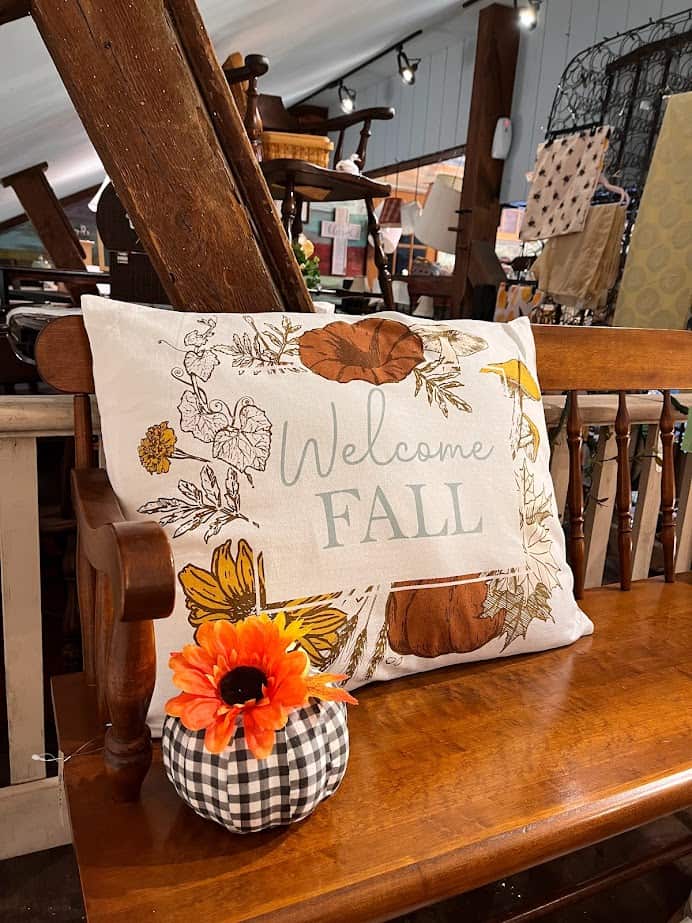 welcome fall pillow on wooden bench